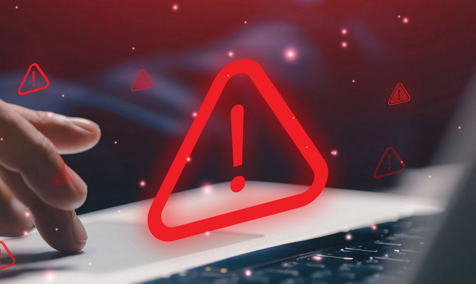 Close up of keyboard with 3D representation of system alarm.