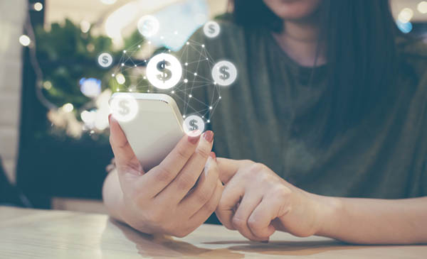 Asian woman hand using mobile phone with online transaction application