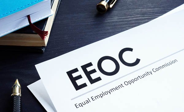 Equal Employment Opportunity Commission (EEOC) document and pen on a table