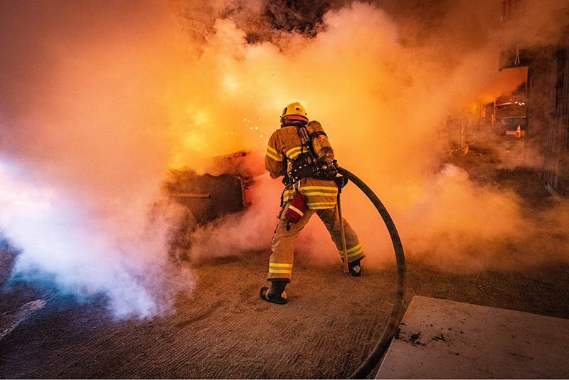 OCFA firefighter battles flames. OCFA firefighter battles flames.