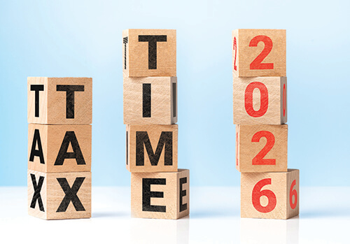 Blocks stacked to spell out "Tax, "Time," "2026."