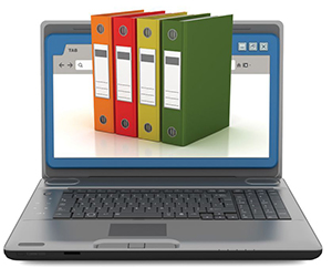 Laptop computer with file books representing system logs.